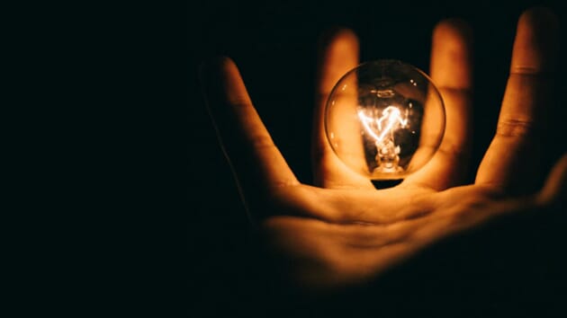 Digital Marketing Products. A hand holds a small lightbulb.