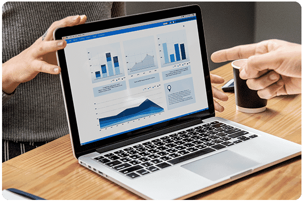 reporting_and_dashboards_man_pointing_at_laptop_screen