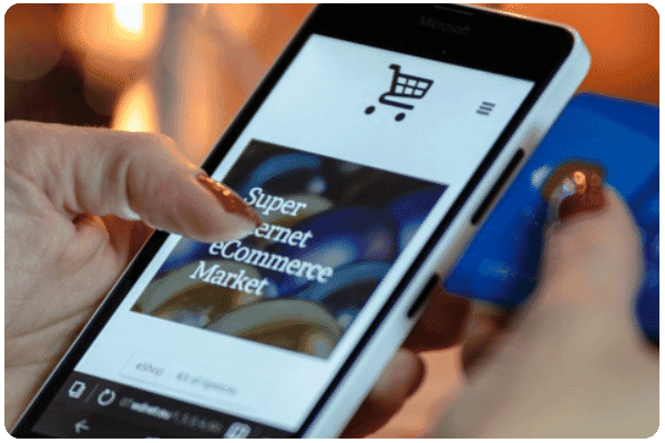 performance_ecommerce_solutions_woman_holding_a_mobile_phone