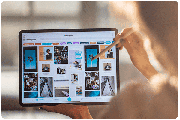 performance_design_and_creative_services_woman_pointing_the_the_dashboard_images_in_the_laptop